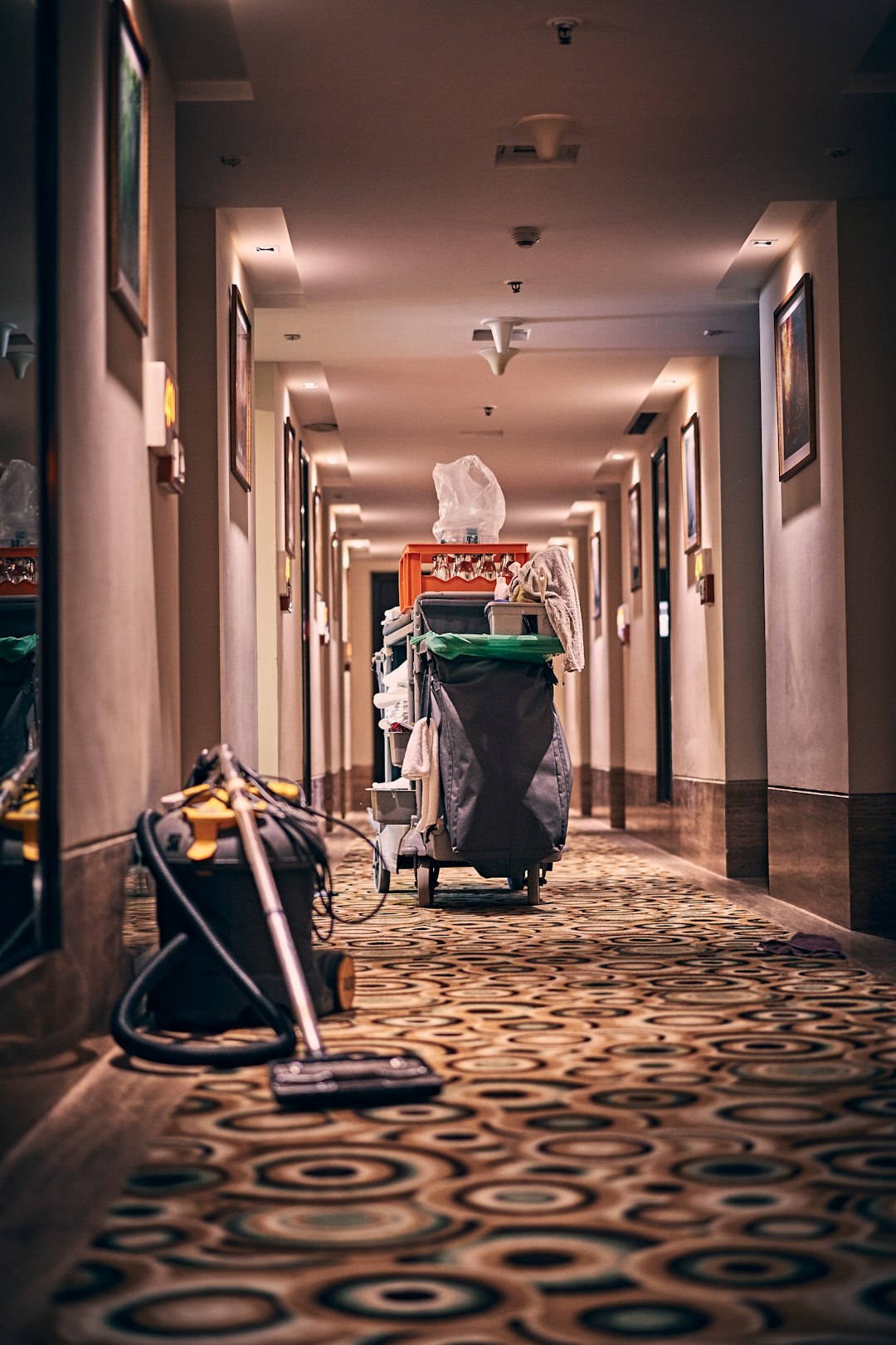 about-us-01 Room cleaning items in hallway